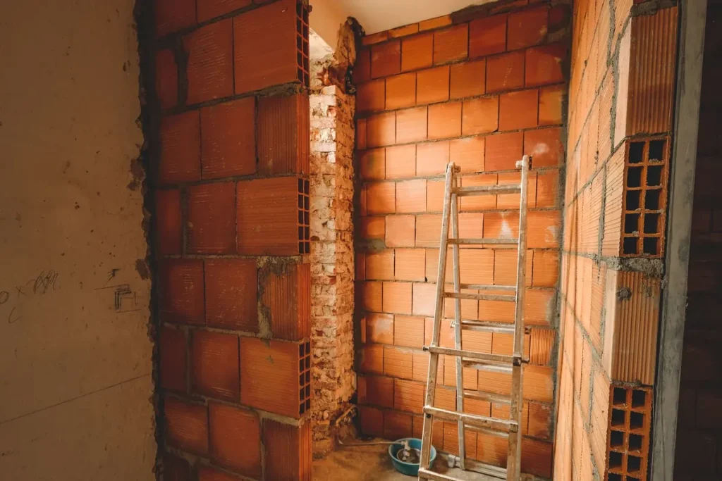 Brick and block wall under construction, crawl space support