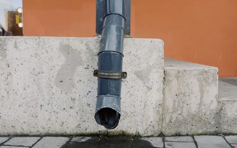 Downspout beside concrete steps in Harrisburg, MO